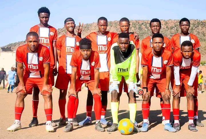 MEI sponsored football team in red kit
